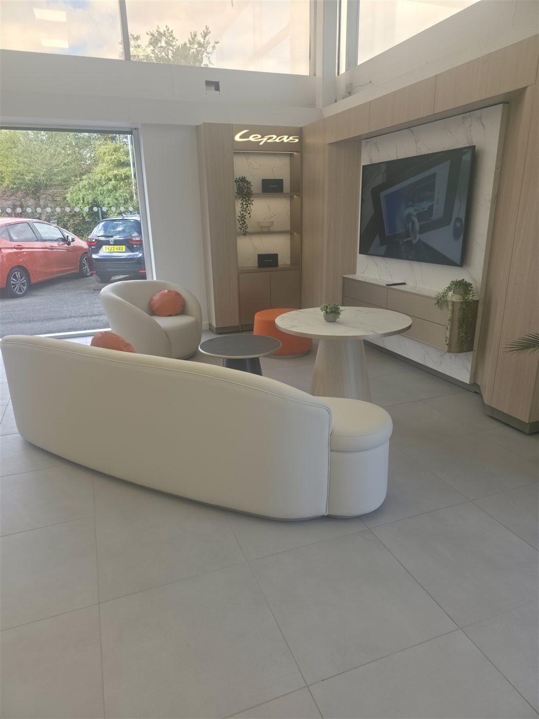 Stone-effect tiled display wall in a commercial showroom