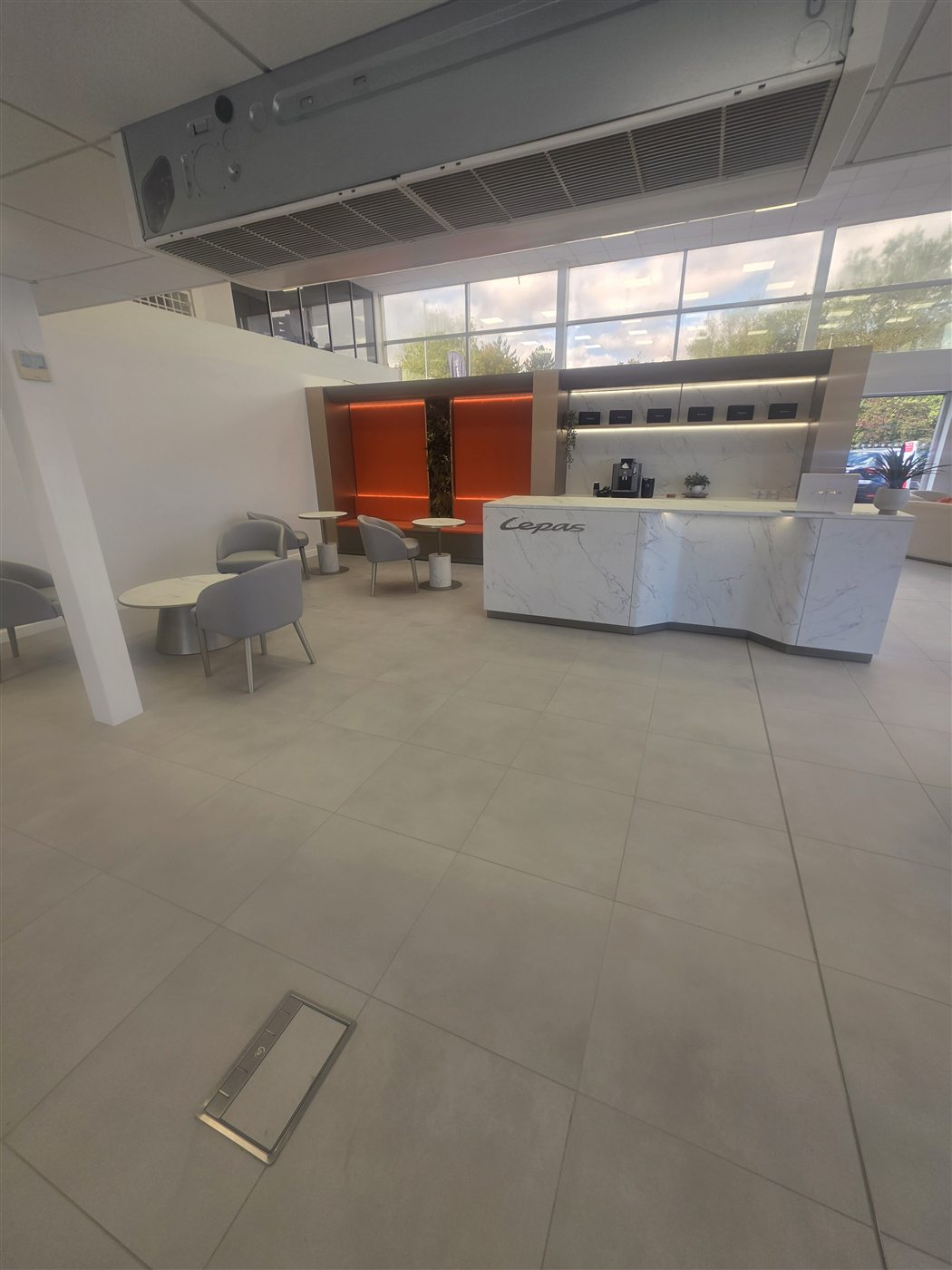 Tiled reception and floor in a commercial showroom