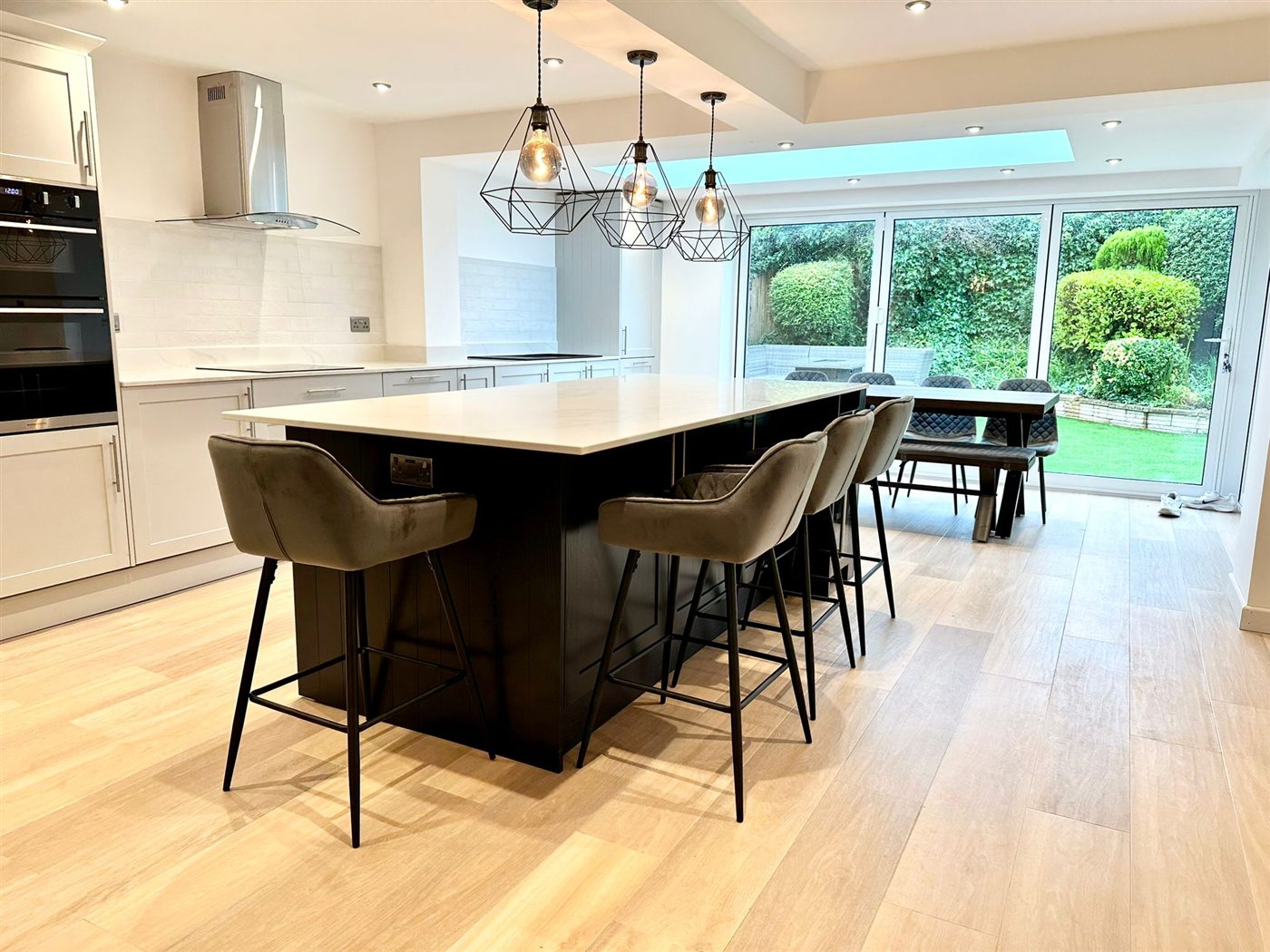 Light tiled floor in an open-plan kitchen